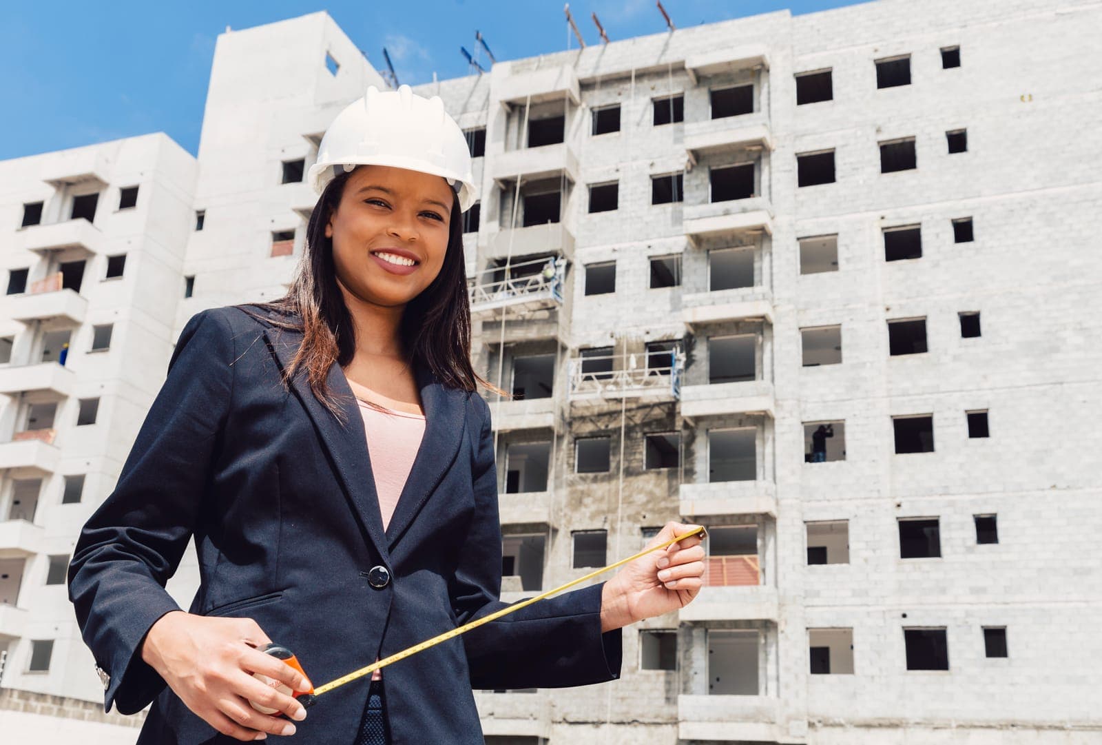 Professional coordinating a construction site visit