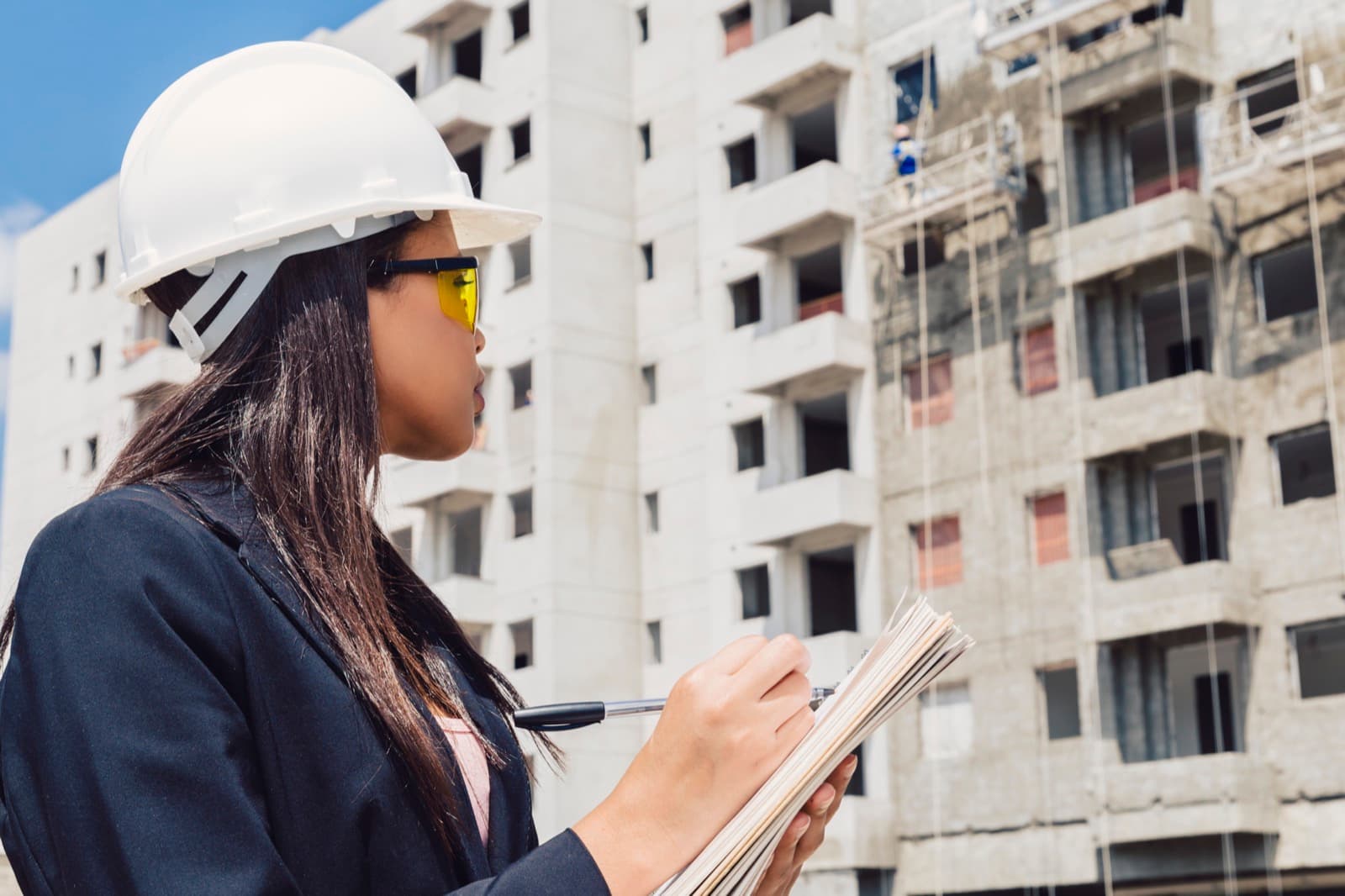 Construction professional inspecting a residential building site